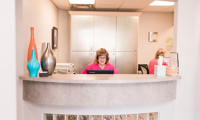 Two women at front reception desk